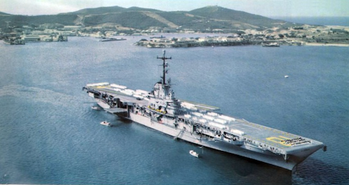The USS Wasp, a large grey war ship, anchored in the Mediterranean.